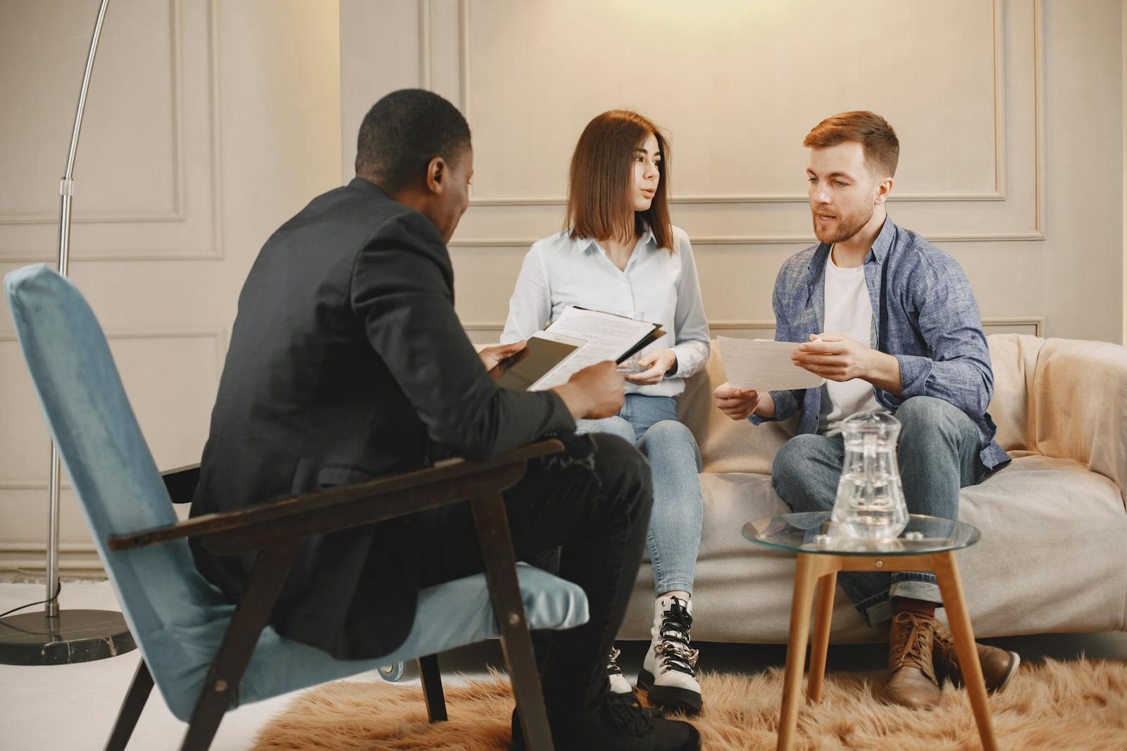 A counseling session with a diverse group of adults discussing issues in a cozy setting.