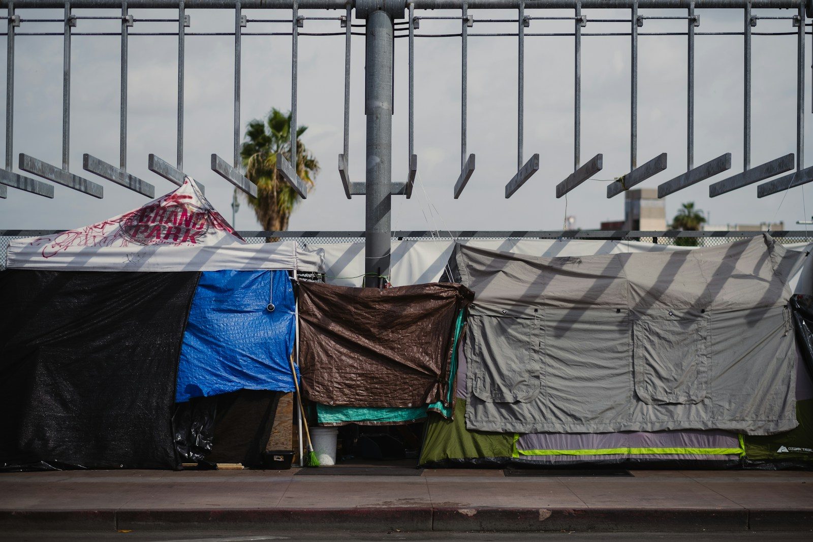 a group of tents sitting on top of a sidewalk